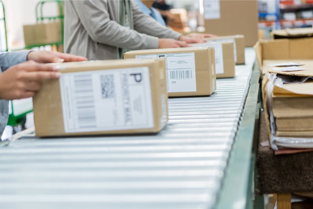 Employees are processing the orders in their warehouse