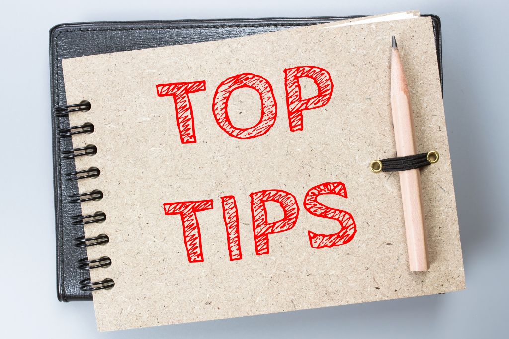 Top tips are written on the cover of a notebook