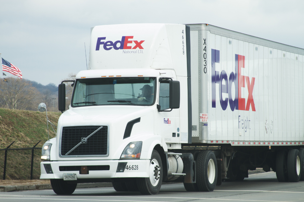 FedEx delivery truck on the road