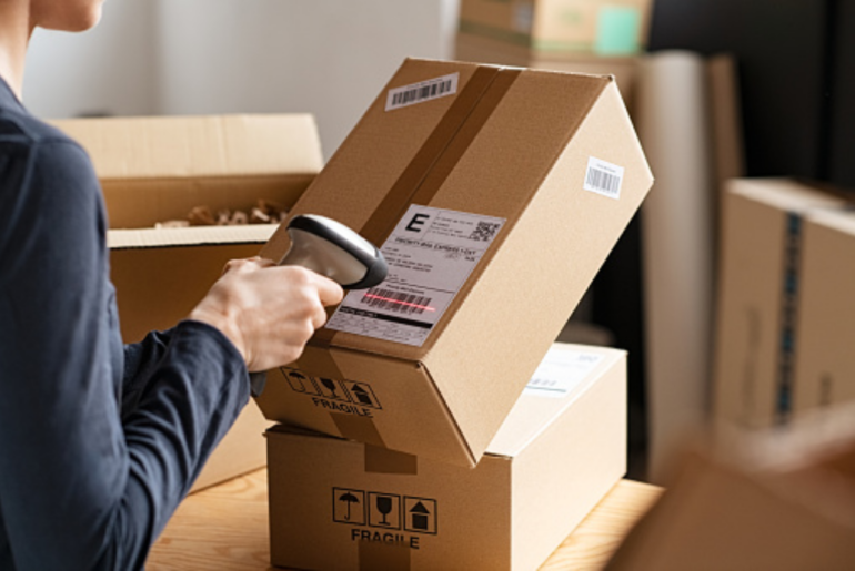 a man scanning a package